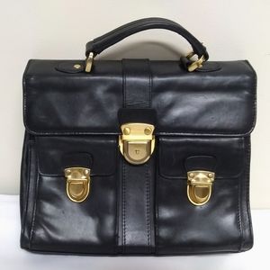 Genuine black leather and brass handbag